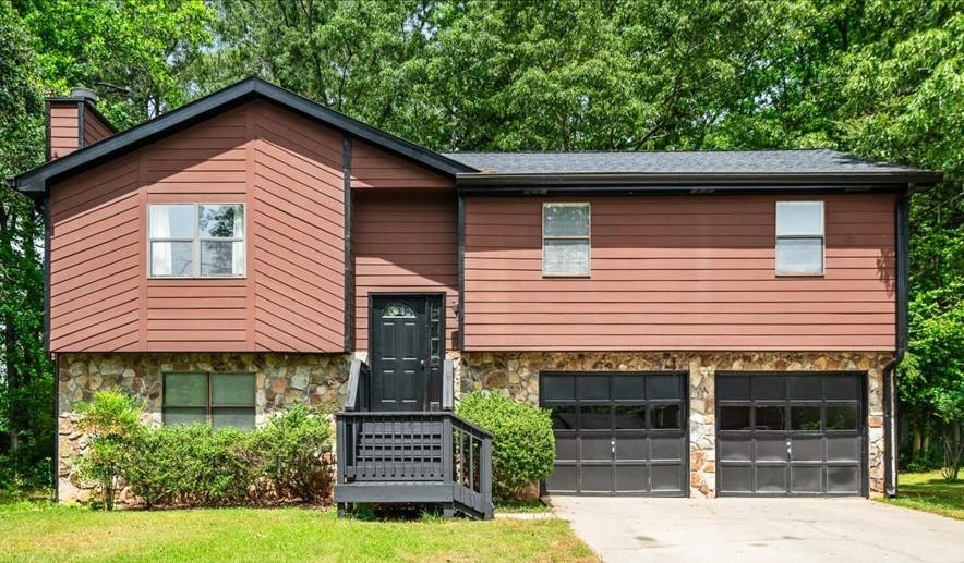2561 Ripple Way Lawrenceville, GA 30043 - Photo 1 of 19 a front view of a house with a yard