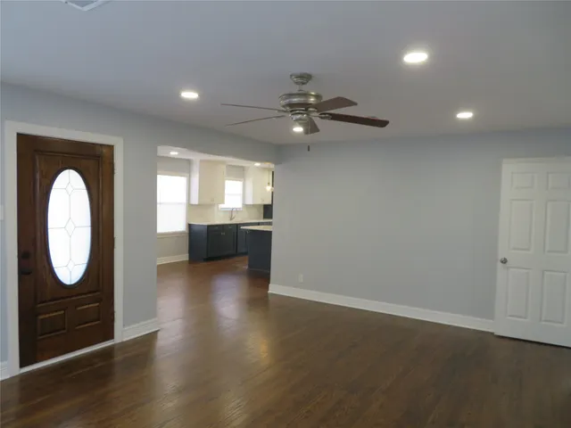 a view of a livingroom with furniture wooden floor and window