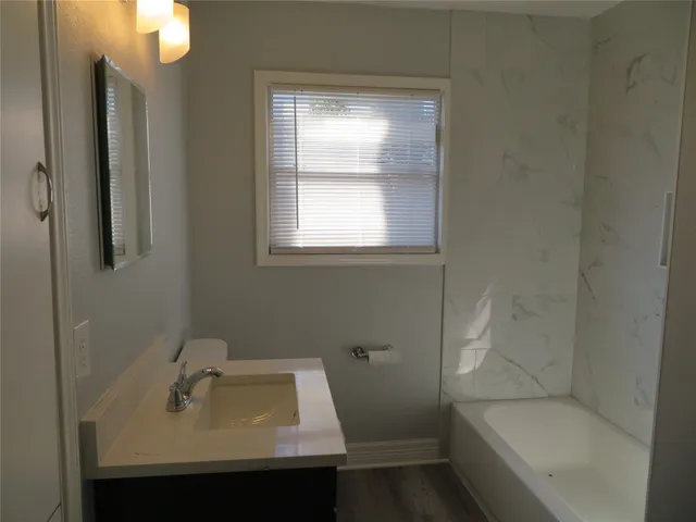 a bathroom with a sink and a bathtub
