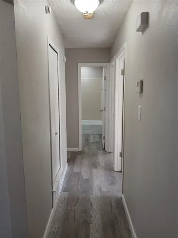 a view of a bathroom from a hallway