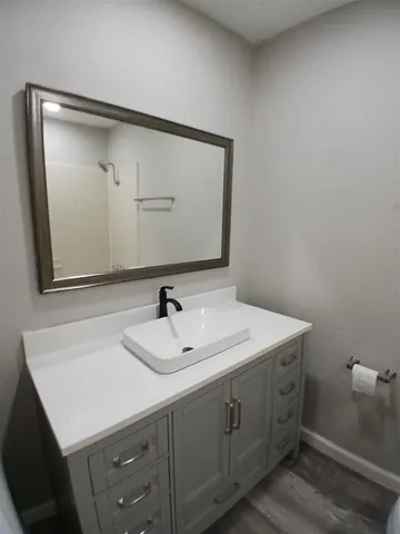 a bathroom with a sink and a mirror