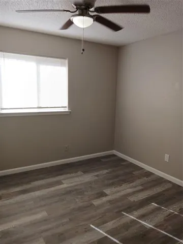 a view of room with window and ceiling fan