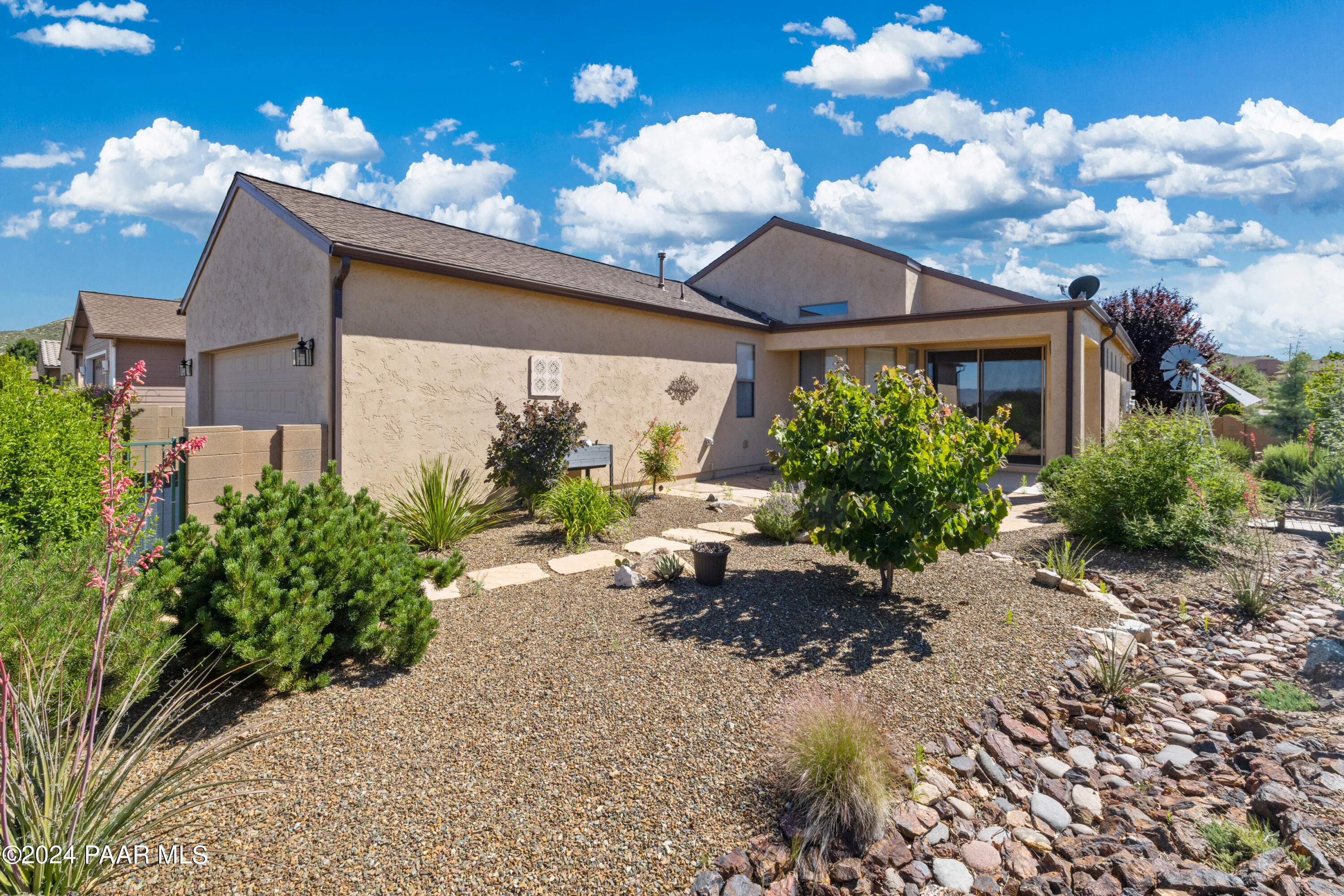 1195 Rigo Ranch Road Prescott Valley, AZ 86314 - Photo 20 of 65 a view of a house with a patio