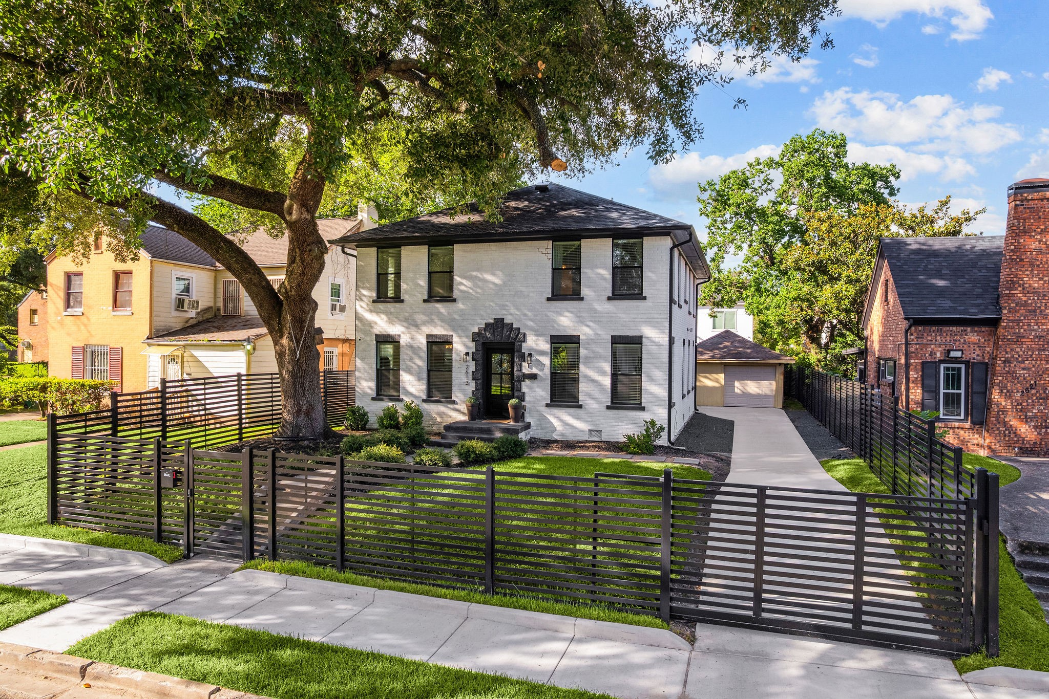 2613 Wichita Street Houston, TX 77004 - Photo 2 of 25 Rare opportunity to own an oversized, fully fenced lot with a gated driveway, detached garage, and expansive yard space perfect for entertaining, pets, or play.