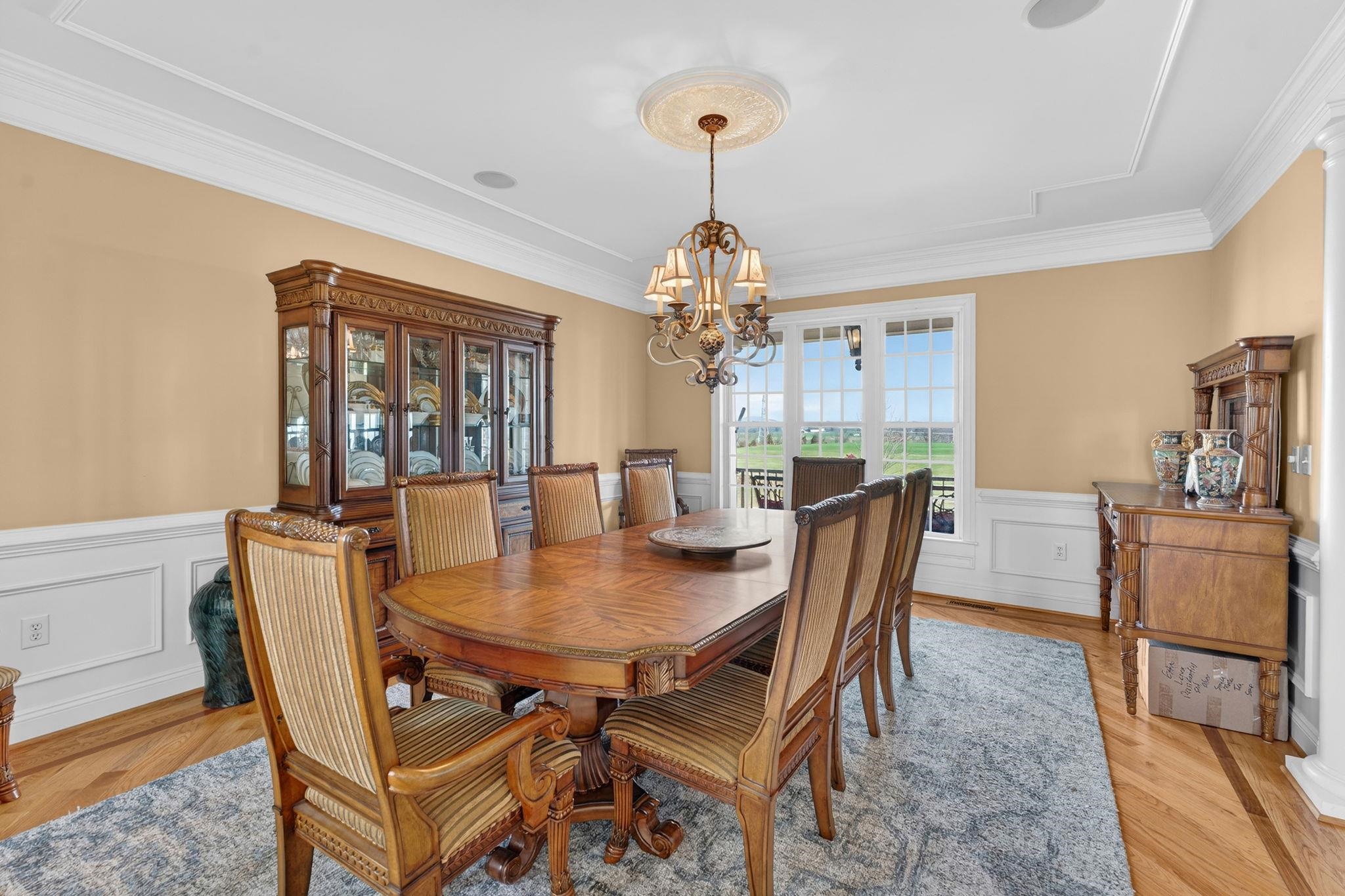 3483 Barterbrook Road Staunton, VA 24401 - Photo 16 of 75 a dining room with furniture a chandelier and wooden floor