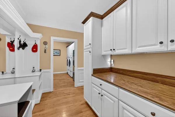 a view of entryway with wooden floor and stairs