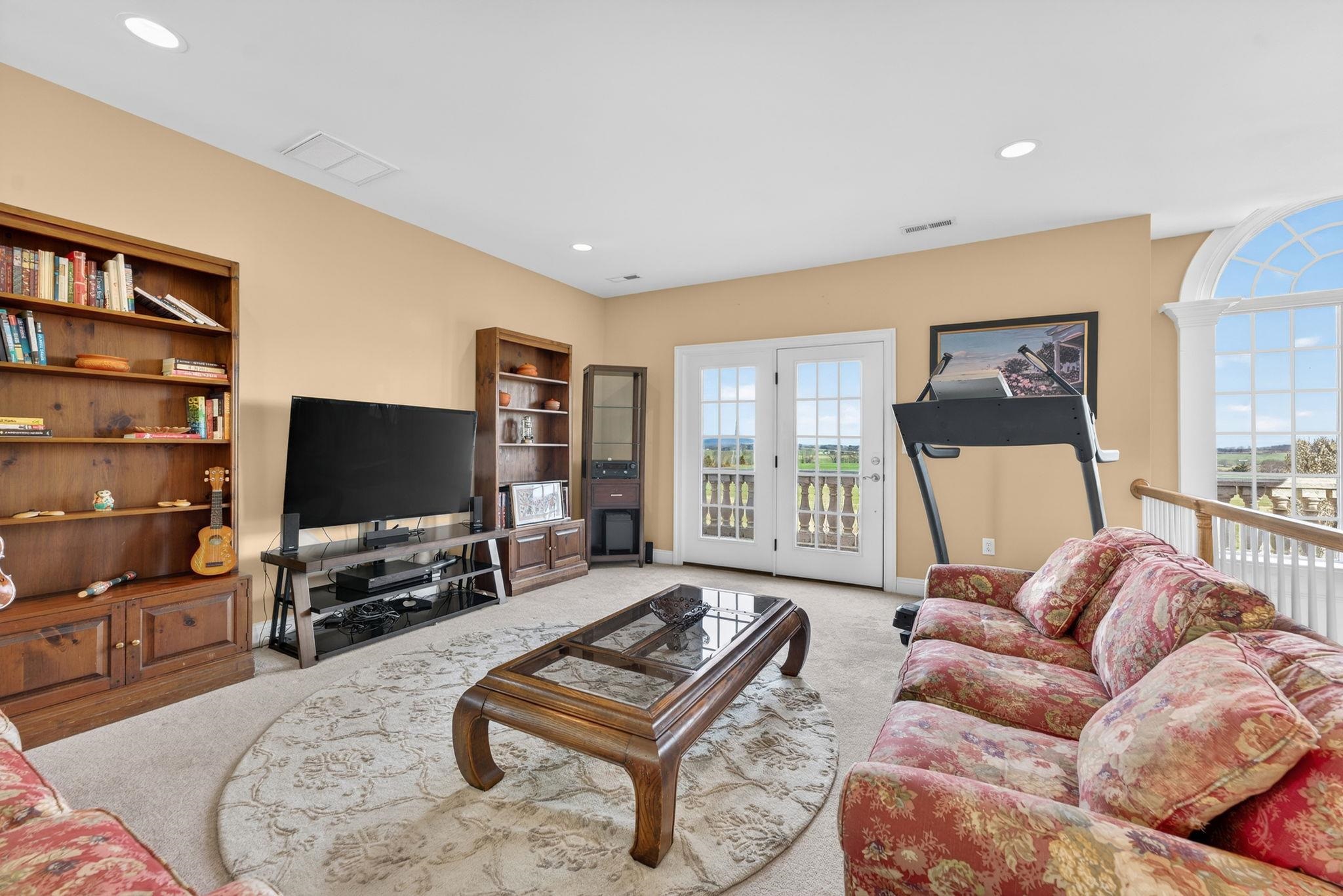 3483 Barterbrook Road Staunton, VA 24401 - Photo 49 of 75 a living room with furniture and a flat screen tv