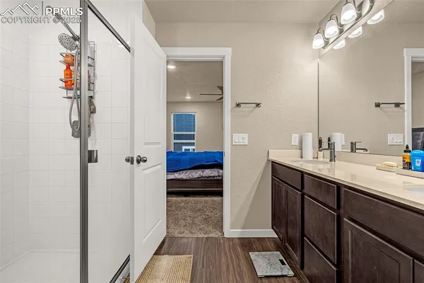 a en suite bathroom with a sink a mirror and a shower
