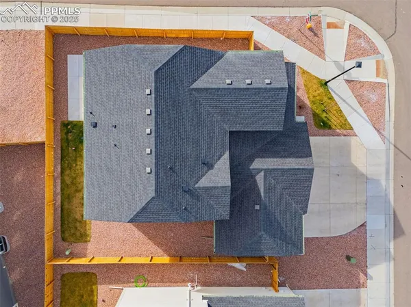 an aerial view of a house with a swimming pool