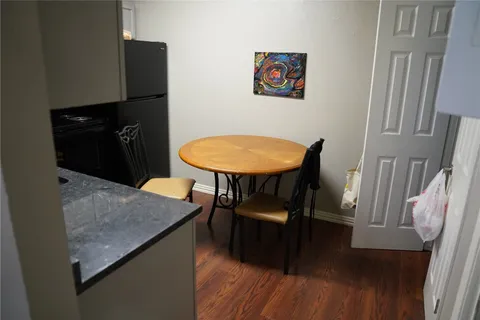 a kitchen with sink and cabinets