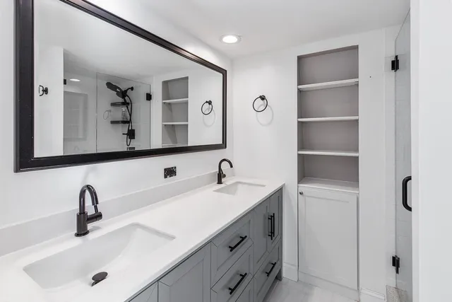 a bathroom with a sink and a mirror