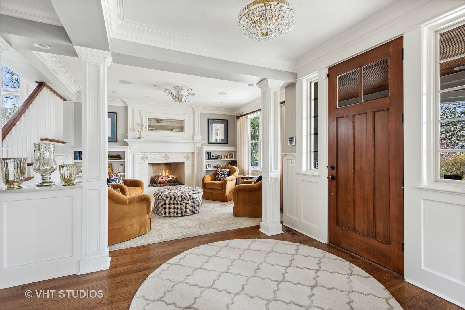 Undisclosed Address Glen Ellyn, IL 60137 - Photo 12 of 55 a living room with furniture a fireplace and a window