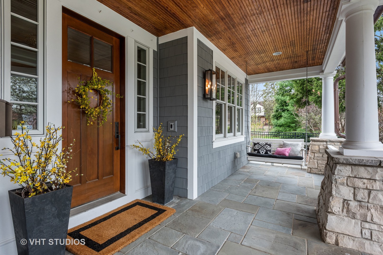Undisclosed Address Glen Ellyn, IL 60137 - Photo 3 of 55 a view of a porch with chairs and floor to ceiling window and wooden floor