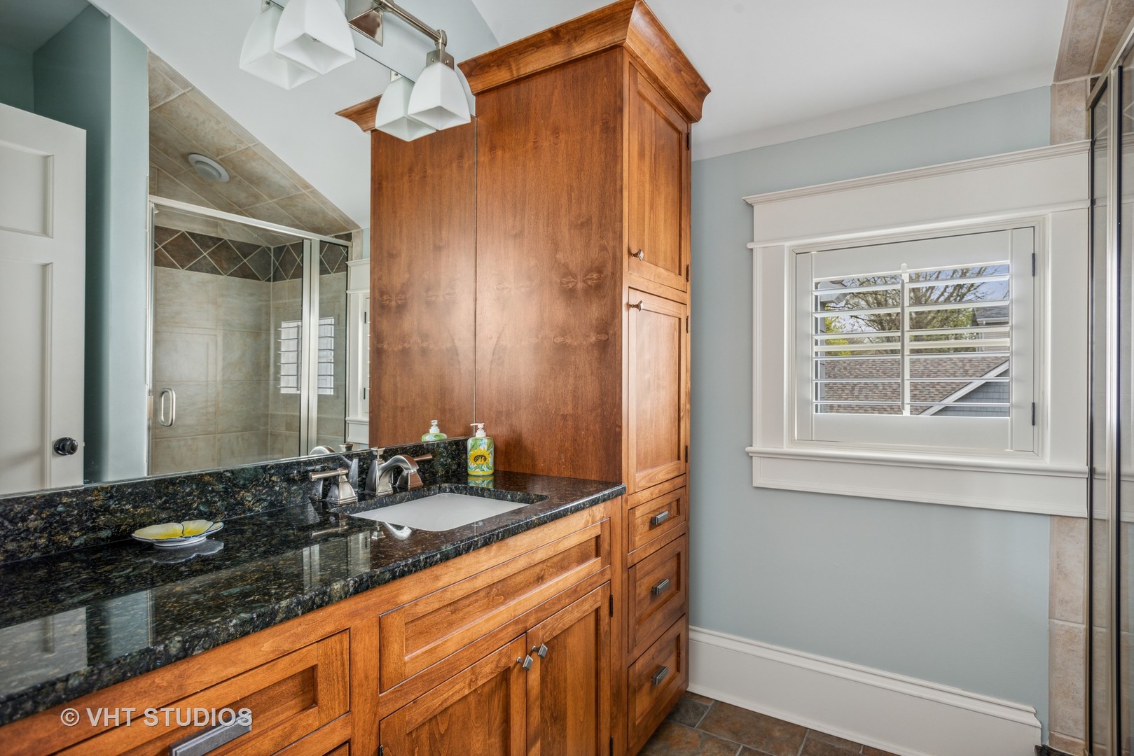 Undisclosed Address Glen Ellyn, IL 60137 - Photo 37 of 55 a bathroom with a granite countertop sink and a mirror