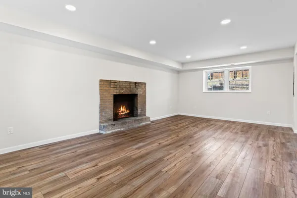 wooden floor in a room next to a window