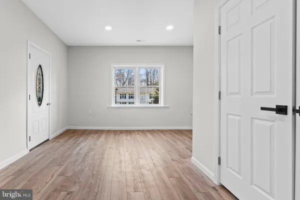 a bathroom with a double vanity sink toilet and a mirror