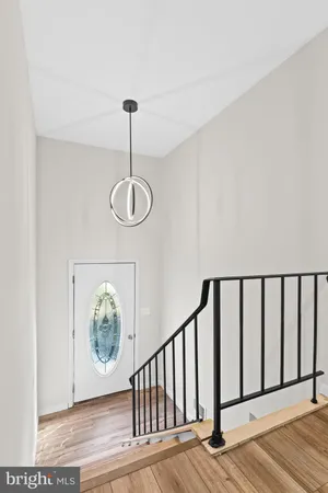 a view of a room with wooden floor