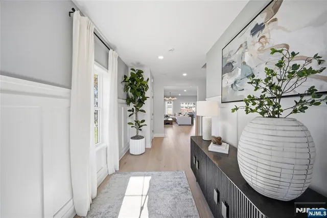 a view of living room filled with furniture and flowers