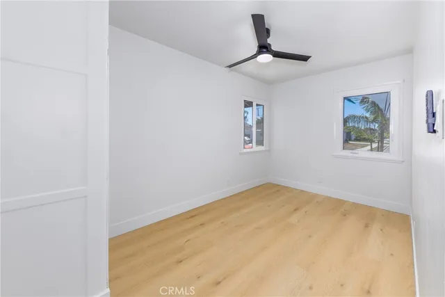 a view of a room with a ceiling fan
