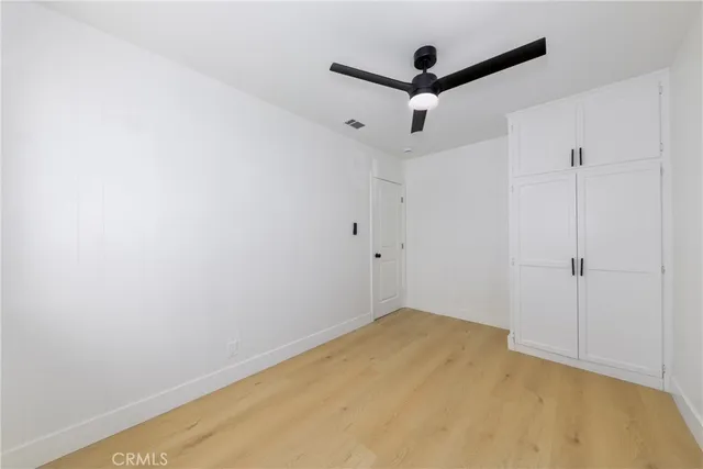 a view of a big room with windows and closet