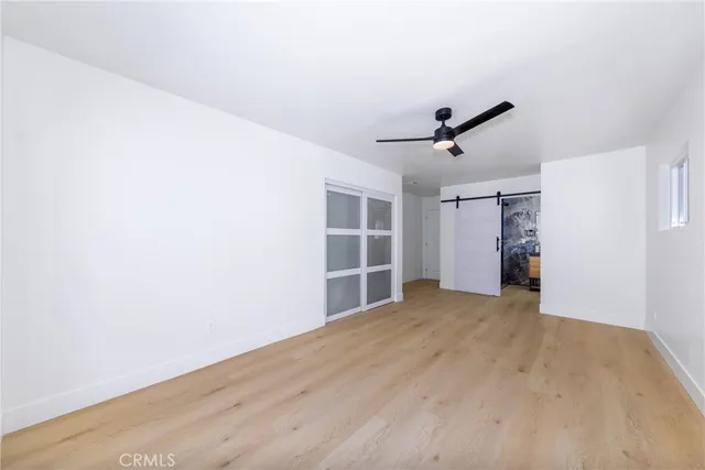 a bathroom with a granite countertop sink a mirror and shower