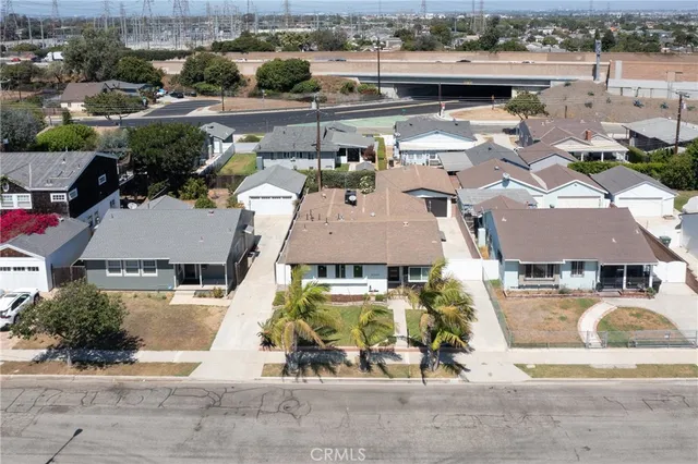 an aerial view of a houses with swimming pool