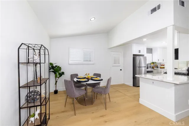 a dining room with furniture and window