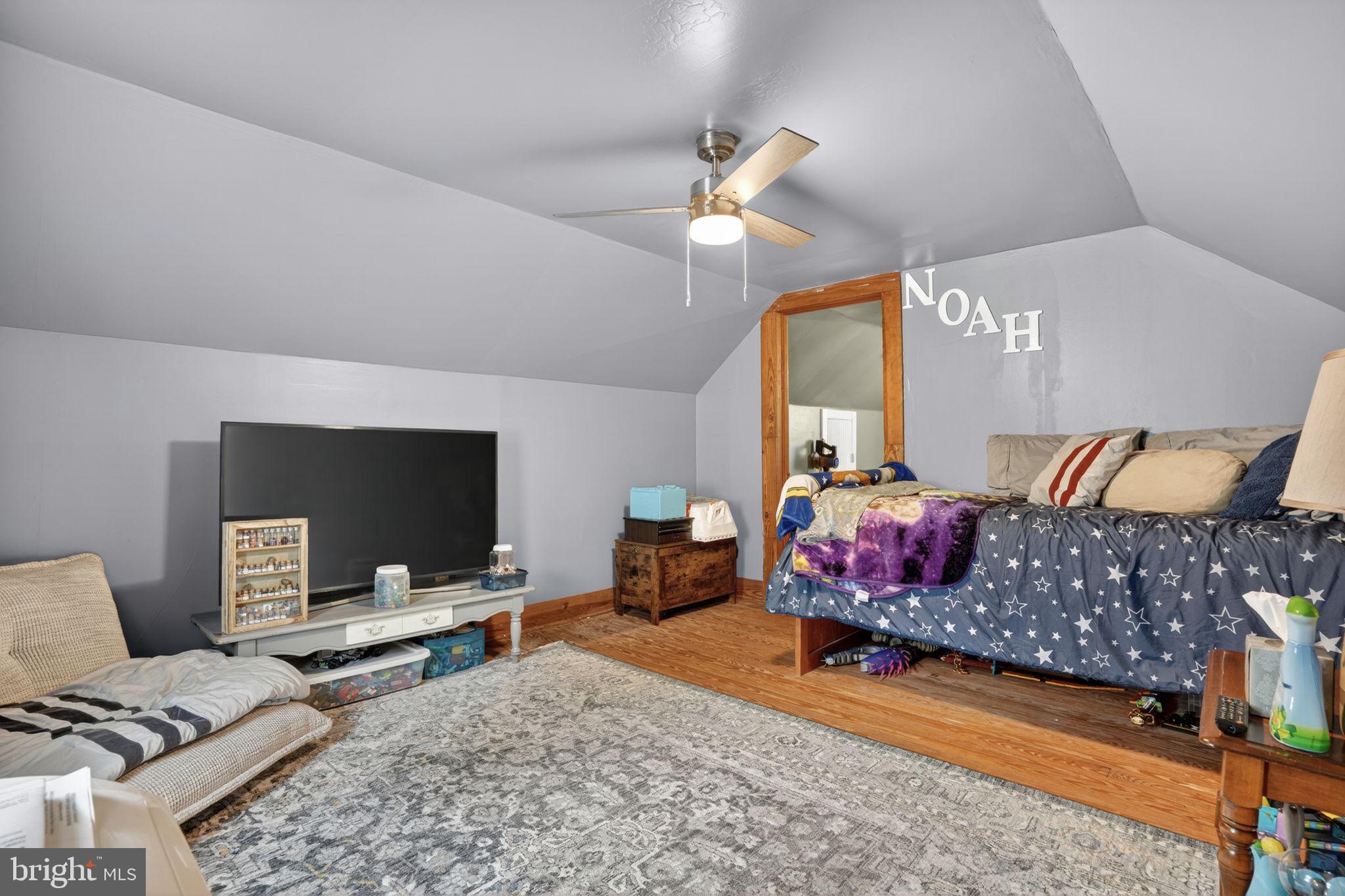 7278 Fleming Road New Church, VA 23415 - Photo 25 of 44 a living room with furniture and a flat screen tv