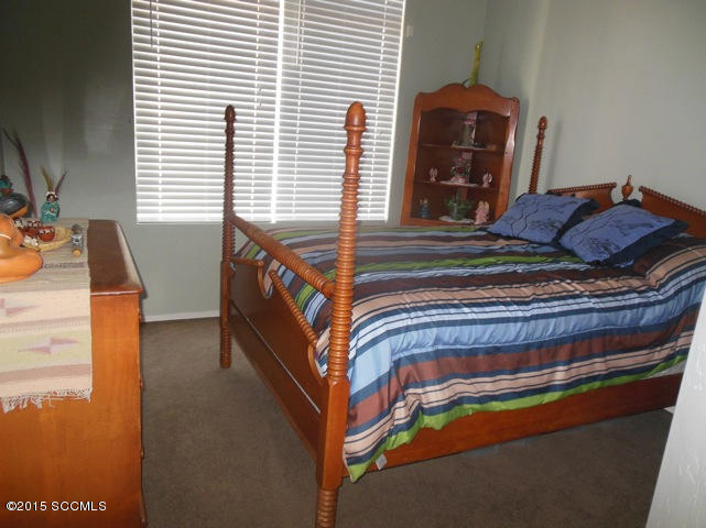 22 Virrey Court Rio Rico, AZ 85648 - Photo 10 of 14 a bedroom with a bed and a window
