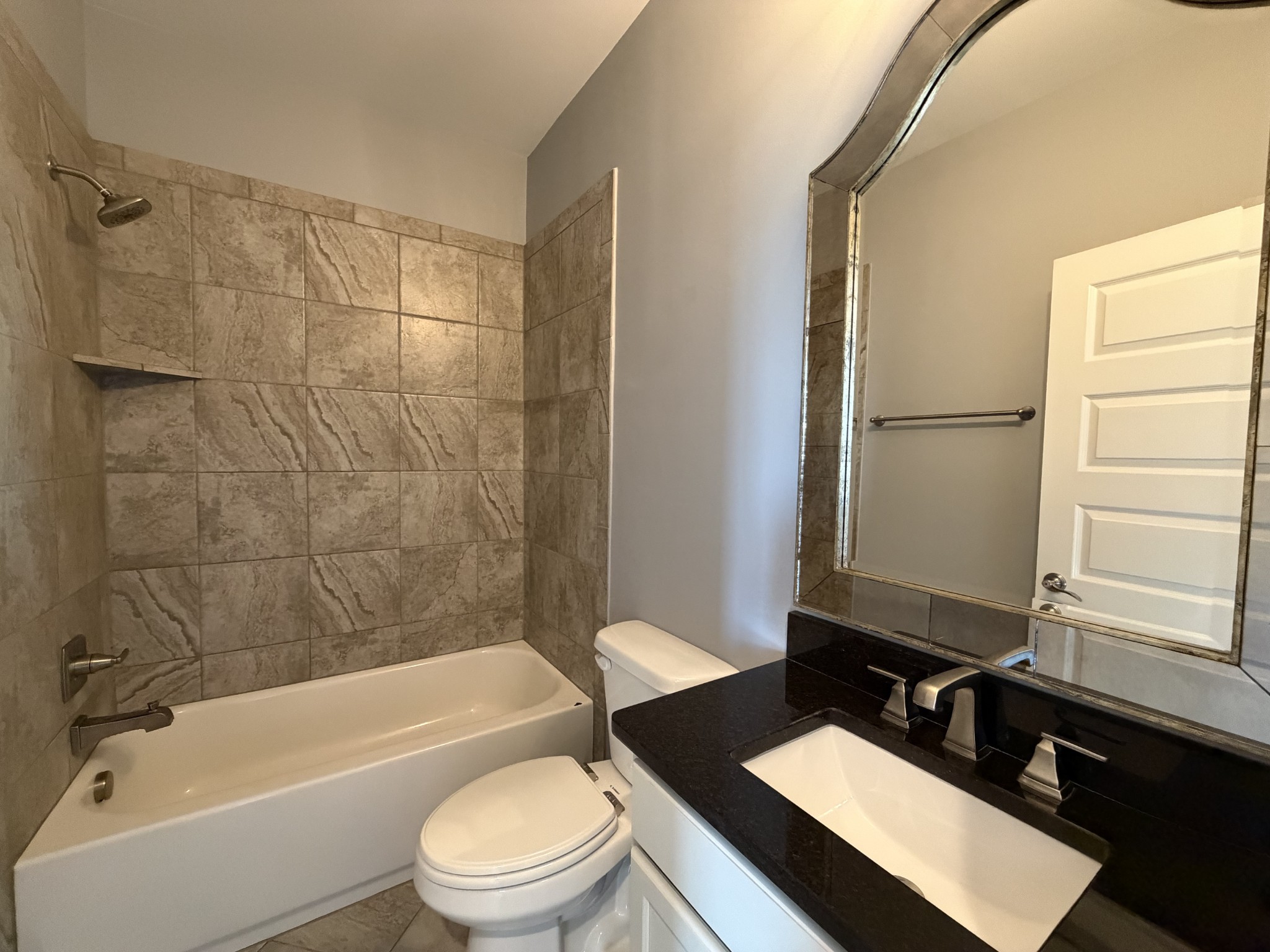 3097 Rural Plains Circle Franklin, TN 37064 - Photo 23 of 28 a bathroom with a granite countertop bathtub shower sink vanity mirror and toilet