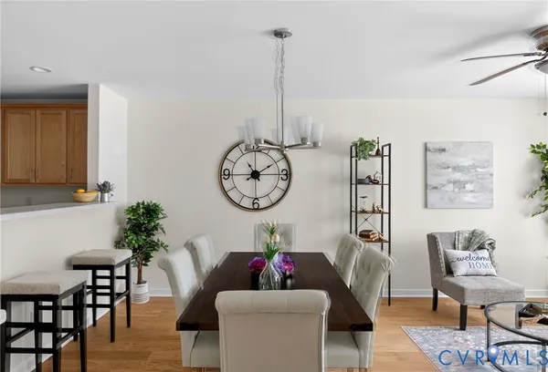 a living room with furniture a window and a chandelier