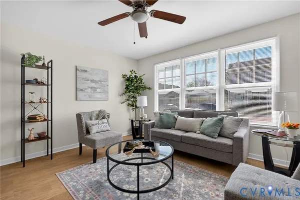 a living room with furniture and a large window