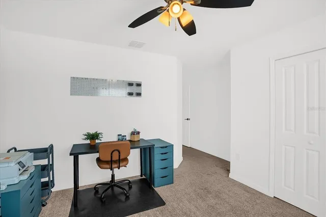 a view of a workspace with furniture