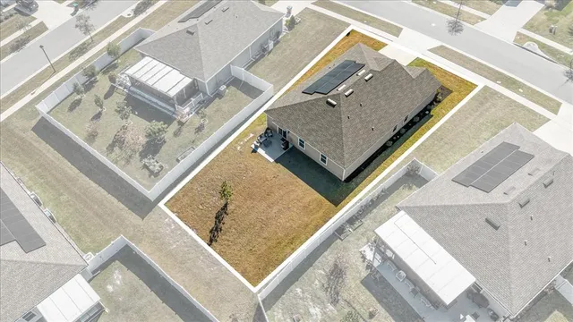 an aerial view of a house with a roof deck