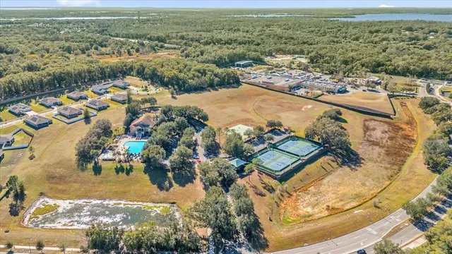 an aerial view of a house with a yard and garden