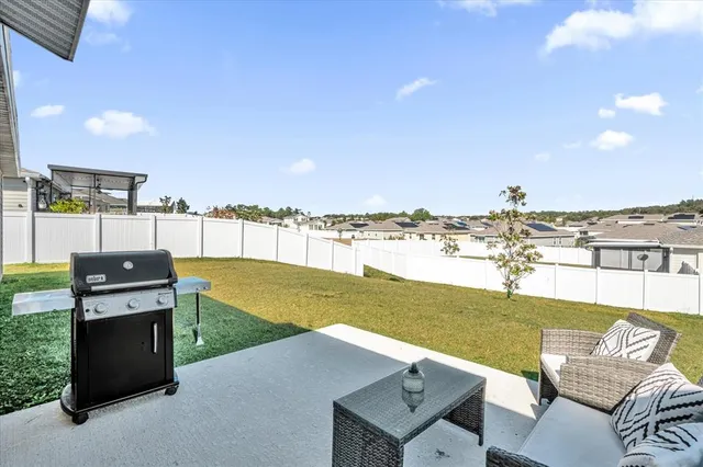 a view of a chairs and table in the terrace