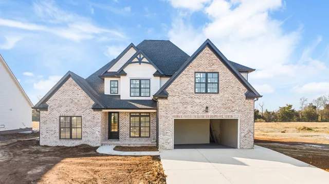 a front view of a house with yard