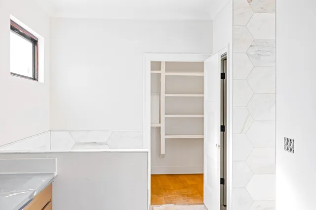 a view of walk in closet with window