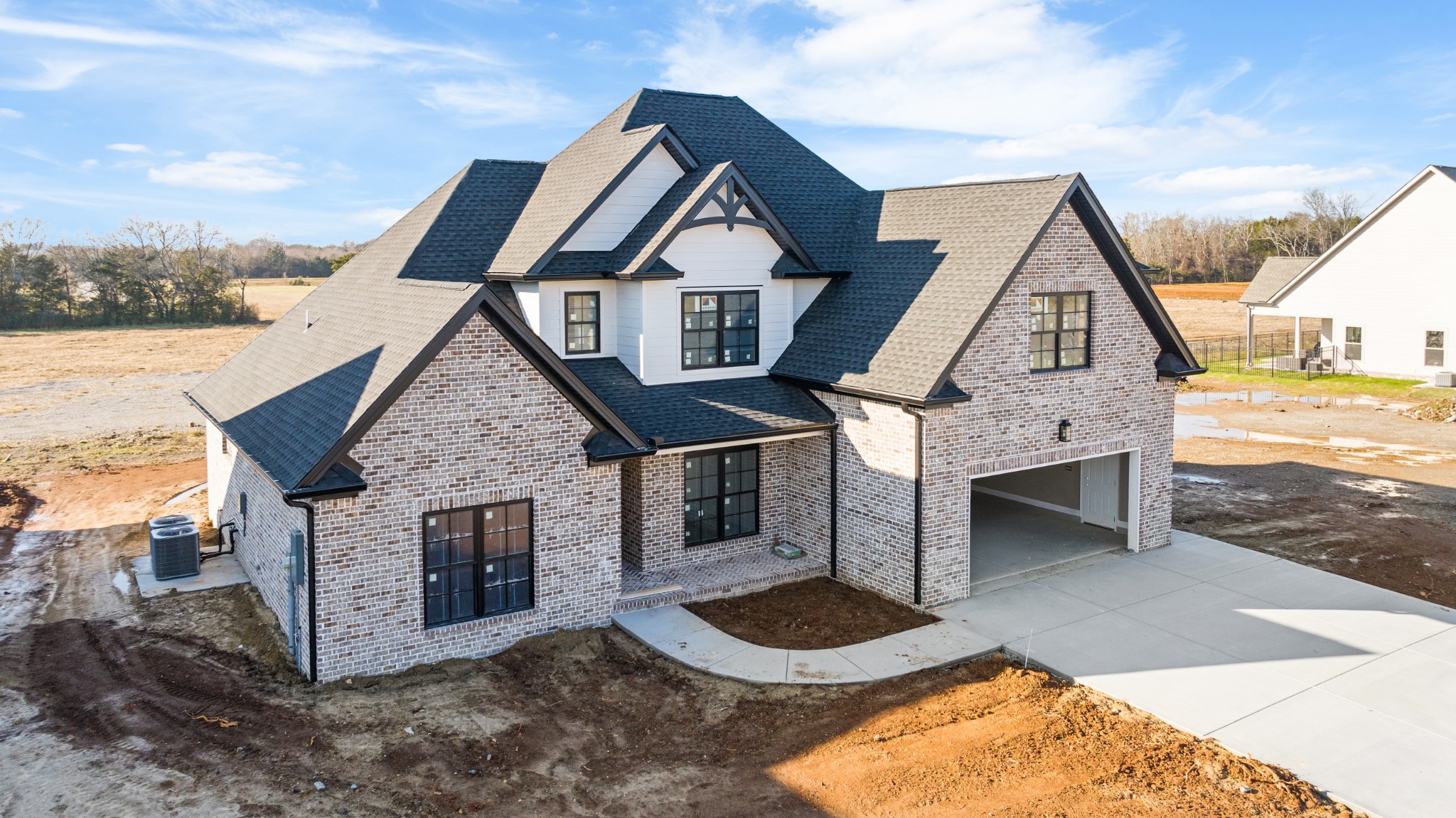 5540 Sinclair Street Murfreesboro, TN 37127 - Photo 5 of 16 a front view of a house with yard garage and kitchen