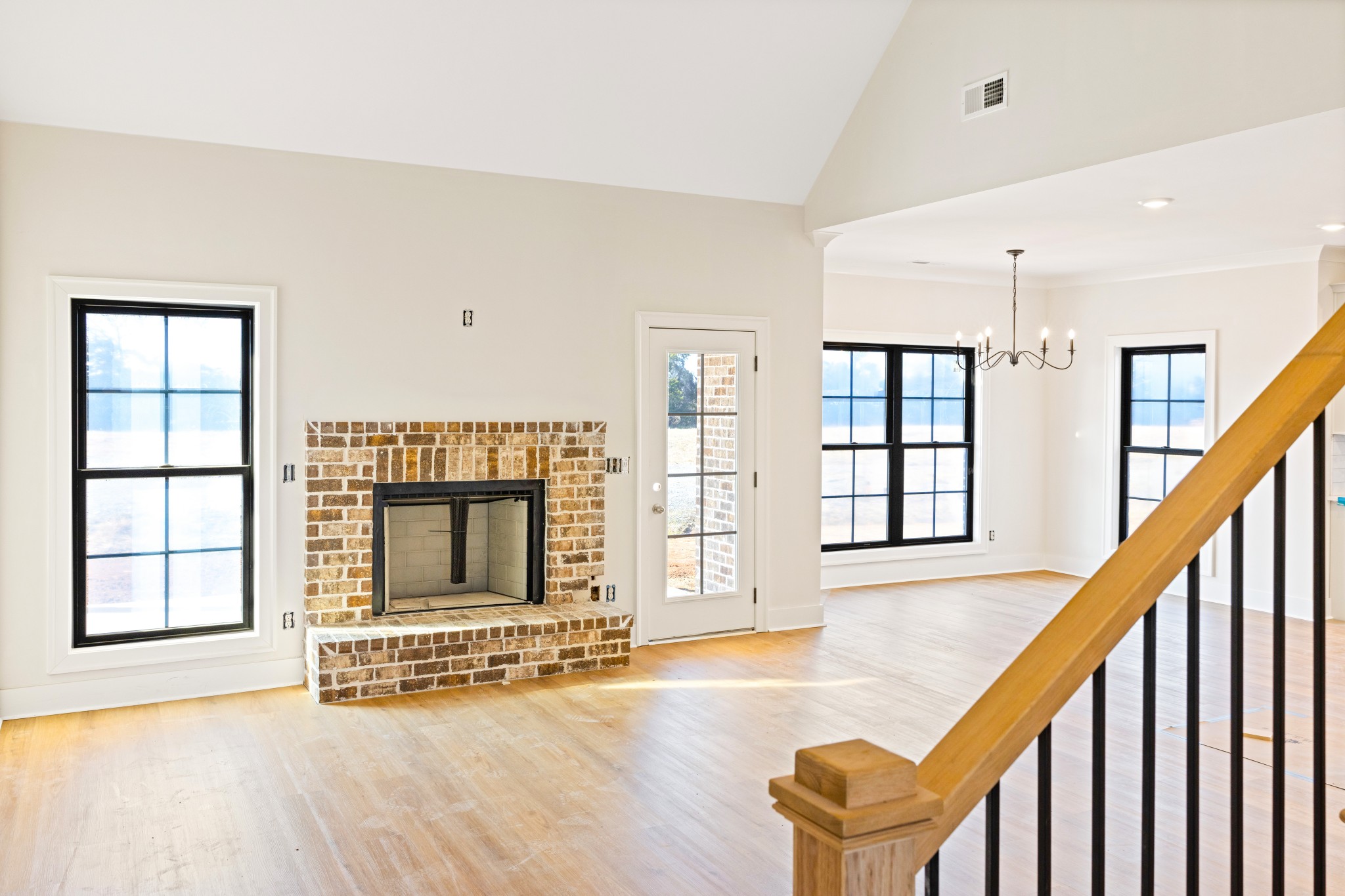 5540 Sinclair Street Murfreesboro, TN 37127 - Photo 8 of 16 a view of an empty room with wooden floor and windows