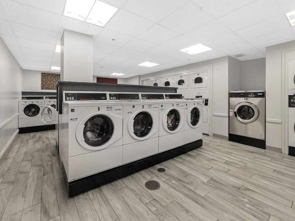 99 Pond Avenue, Unit 509 Brookline, MA 02445 - Photo 11 of 19 a utility room with dryer and washer