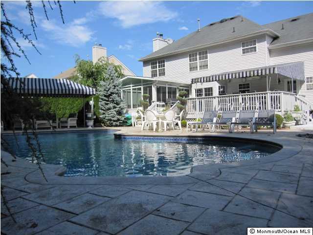 396 Meadowood Road Jackson, NJ 08527 - Photo 1 of 3 a view of house with swimming pool and outdoor seating