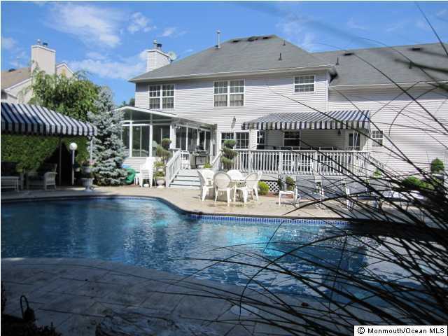 396 Meadowood Road Jackson, NJ 08527 - Photo 3 of 3 a front view of a house with swimming pool