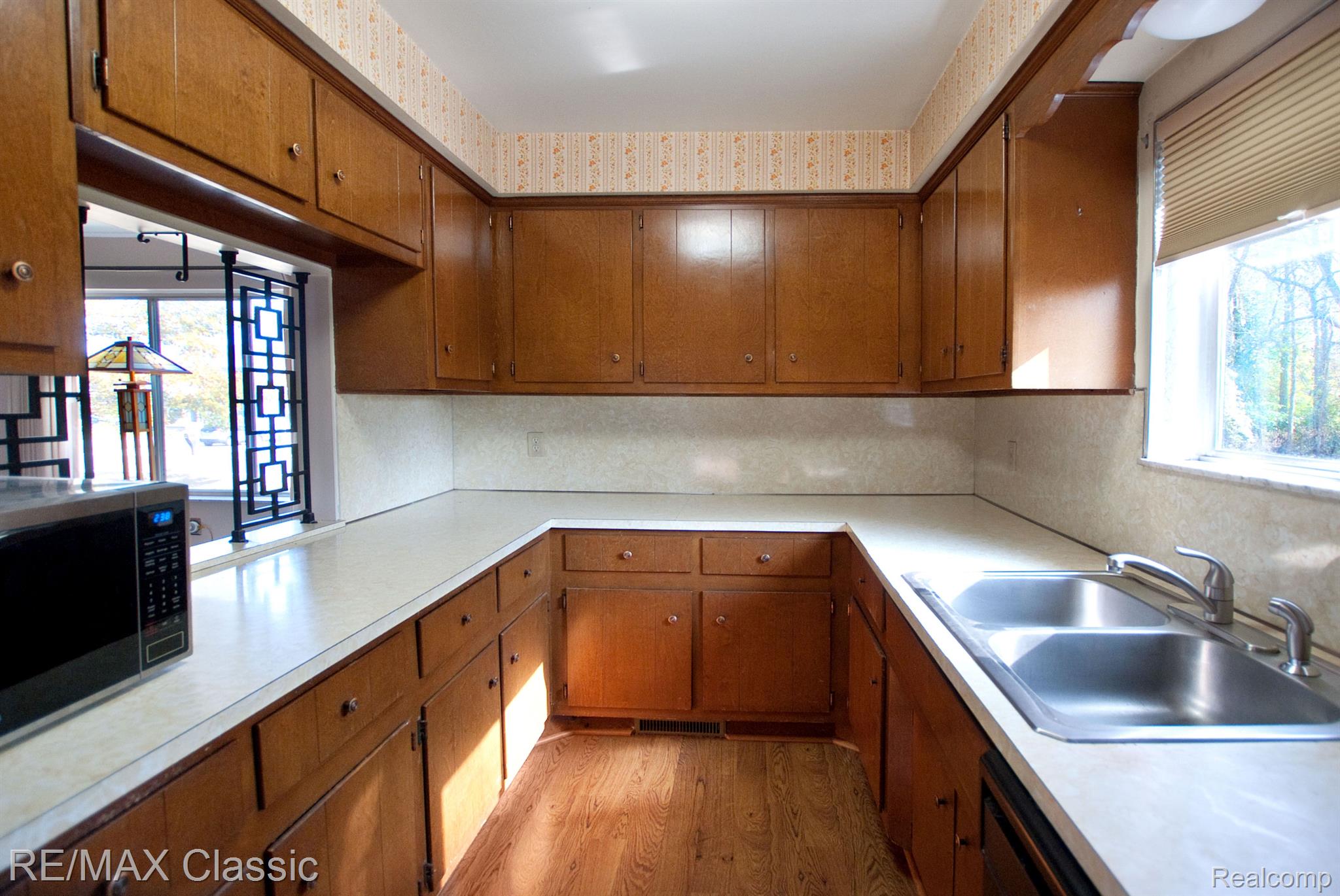 5959 Carroll Lk Road Commerce Township, MI 48382 - Photo 8 of 33 Galley style kitchen. 2 pantries.