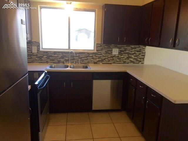4415 Beaumont Road Colorado Springs, CO 80916 - Photo 11 of 29 Ample counter and cabinet space.