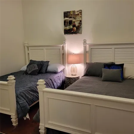 a bedroom with bed and window
