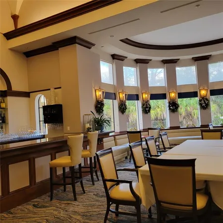 a view of a dining room with furniture and window