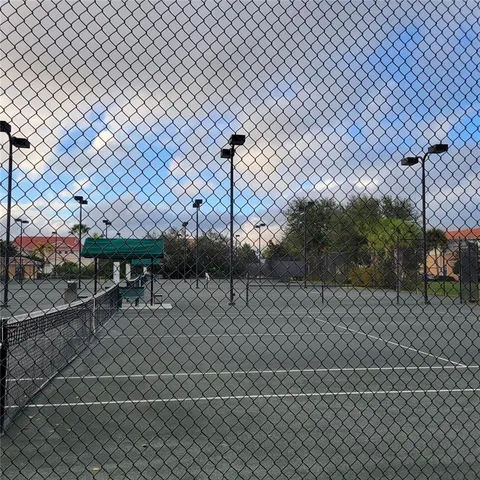 a view of a lake with houses in the back