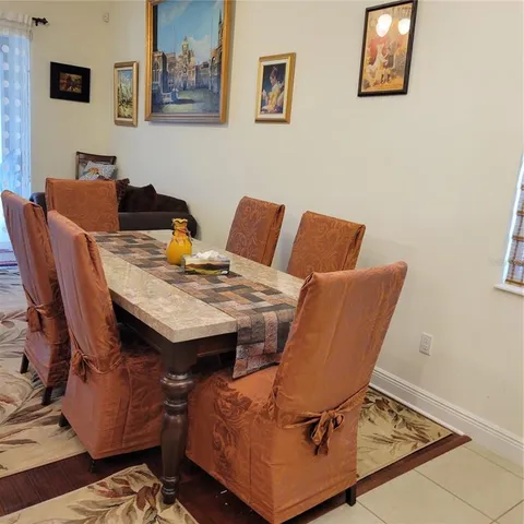 a view of a workspace with furniture