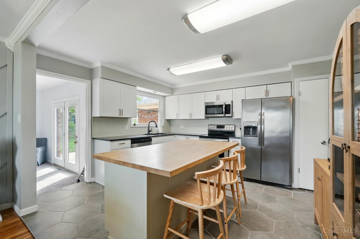7510 Lawyer Road Cincinnati, OH 45244 - Photo 7 of 55 Kitchen has newer island with counter bar